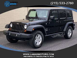 2010 Jeep Wrangler Unlimited Sport 1J4HA3H15AL103889 2010 Jeep Wrangler Unlimited Sport
